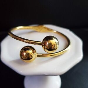 Kate Spade New York Golden Girl Gold Tone Hinged Bypass Balls Bangle Cuff